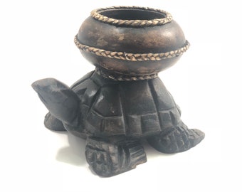 3”tall wooden turtle. Candle or succulent holder. Hand carved tabletop decor. Add to your collection.
