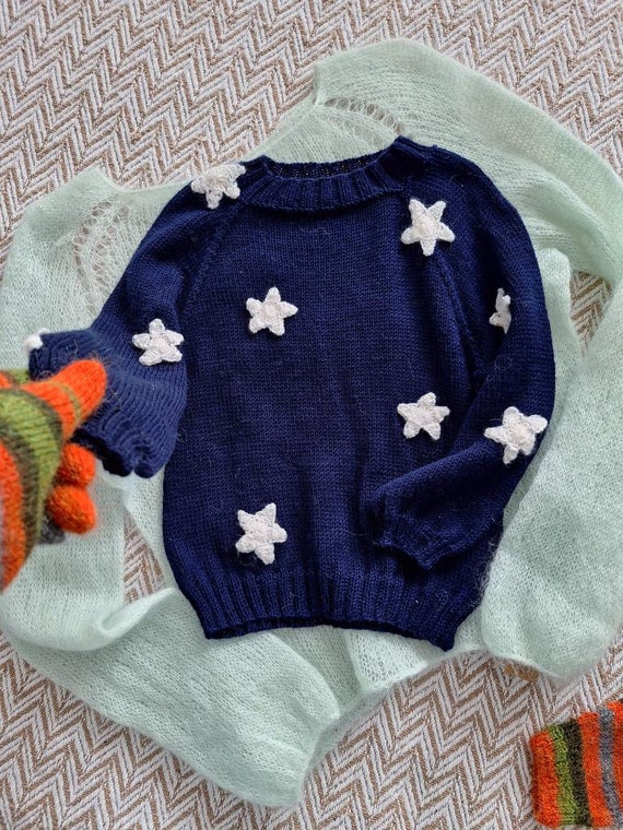 Blue sweater with store white stars