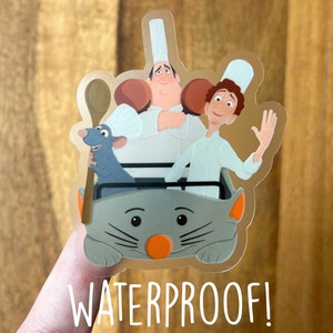 May include: A waterproof sticker featuring Remy the rat, Linguini, and Chef Gusteau from the movie Ratatouille. The characters are riding in a rat-shaped vehicle.