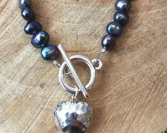 Beautiful oily peacock black freshwater pearl bracelet with toggle clasp and heart detail