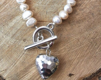White baroque freshwater pearl bracelet with toggle clasp and hammered silver heart detail