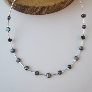 Oily black freshwater pearl and silver spacer necklace