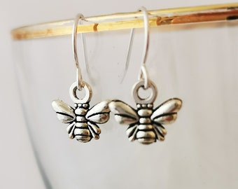 Tiny dangly bumble bee earrings. Silver plated, nickel free, hypoallergenic