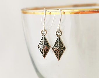 Celtic diamond shape small silver dangly earrings. Silver plated, nickel free and hypoallergenic