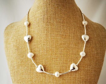 Freshwater pearl and hammered silver heart bead necklace. Adjustable length 18-20 inches