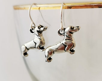 Dangly silver sausage dog earrings. Silver plated, hypoallergenic, nickel free