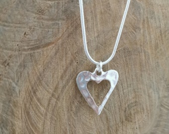 Hammered silver heart necklace. Silver plated pendant on silver plated snake chain. 18 inches.