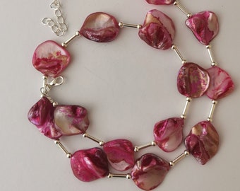 Bright pink necklace made from shell beads