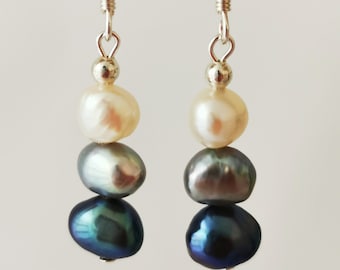 Three tone freshwater pearl earrings. Black, grey and white. On sterling silver hooks