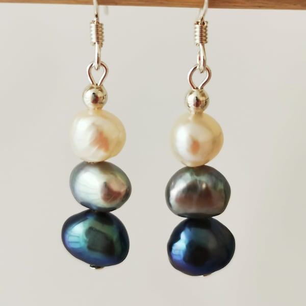 Three tone freshwater pearl earrings. Black, grey and white. On sterling silver hooks