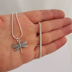 Pretty dragonfly necklace. Silver plated pendant on silver plated snake chain. 18 inches.