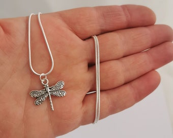 Pretty dragonfly necklace. Silver plated pendant on silver plated snake chain. 18 inches.