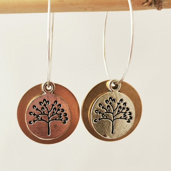 Tree of life hoop earrings, silver and bronze coloured discs with tree of life.