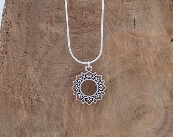 Silver mandala necklace necklace. Silver plated pendant on silver plated snake chain. 18 inches.