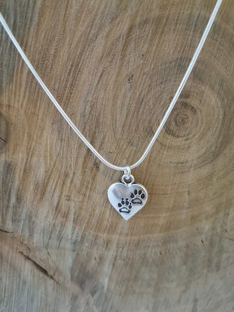 Silver pawprint heart necklace. Silver plated pendant on silver plated snake chain. 18 inches. image 1