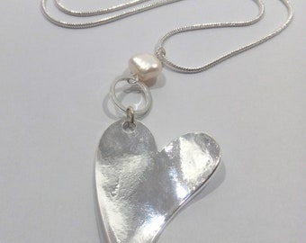 Long heart and freshwater pearl pendant on a snake chain