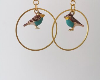 ゴールドのサークルと鳥のイヤリング - Etsy 日本