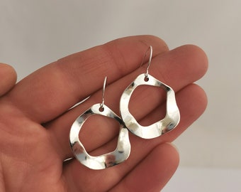 Beaten silver circle earrings. Silver loop earrings, hypoallergenic and nickel free.