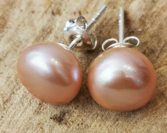 Natural peach coloured freshwater pearl stud earrings. Sterling silver