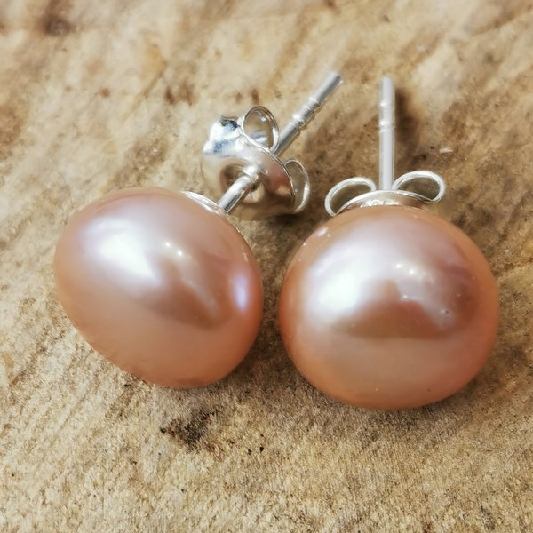 Natural peach coloured freshwater pearl stud earrings. Sterling silver