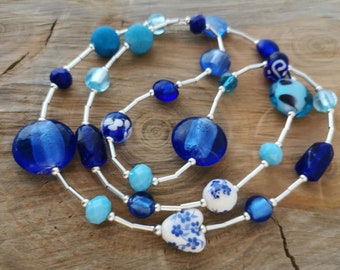 Funky long mixed bead blue necklace.