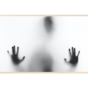 May include: A black and white photograph of a blurry figure with outstretched hands, appearing as if behind a frosted glass surface.
