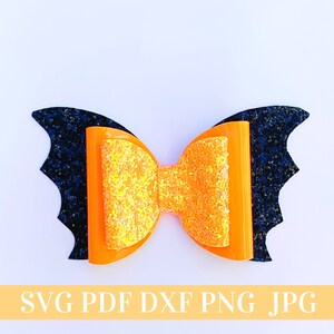 May include: Orange and yellow glitter bow with black glitter bat wings.  SVG PDF DXF PNG JPG