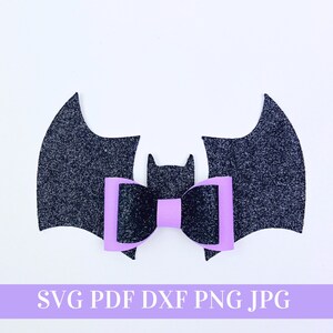 May include: Black glitter bat wings with a purple bow in the centre. SVG PDF DXF PNG JPG.