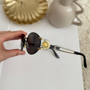 Authentic Vintage Sunglasses, 90s Made Sunglasses, Black Framed Deadstock Sunglasses, New Old Stock, Handles with Sun Medallion Detail