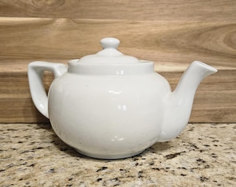Vintage White Ceramic Teapot for a Country Kitchen