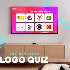 May include: A television screen displaying a logo quiz game with the text "ROUND 1 MISCELLANEOUS" and "Can you name all eight..."  The screen shows eight different logos, including a yellow tag with the letter "B", a red and blue Pepsi logo, a red "F" logo, a green John Deere logo, a red and white Nike logo, a black swan logo, a black CBS eye logo, and a red and yellow Kodak logo. The text "THE ULTIMATE LOGO QUIZ" is displayed below the television screen.