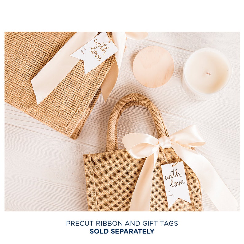 May include: Two brown burlap gift bags with handles, one with a white gift tag that says "with love" and a beige ribbon, and the other with a white gift tag that says "with love" and a beige ribbon.