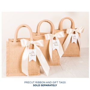 May include: Three brown burlap tote bags with white satin ribbon bows and white gift tags that say "with love" in gold lettering.