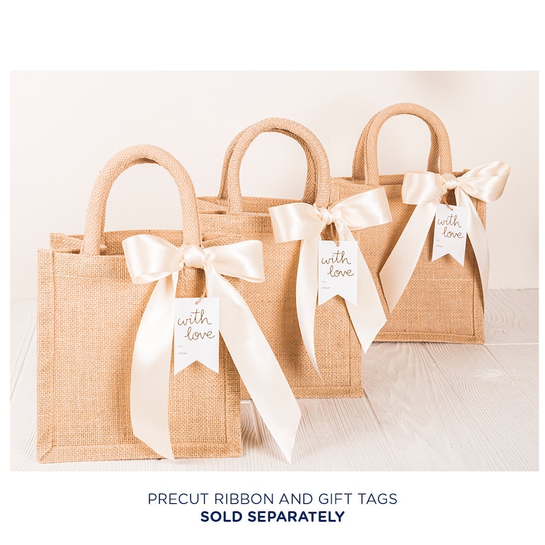 May include: Three brown burlap tote bags with white satin ribbon bows and white gift tags that say "with love" in gold lettering.