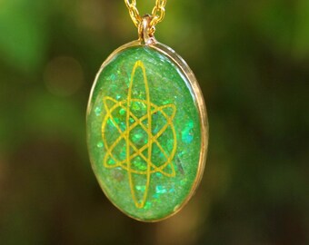CLEARANCE - Gold and Green Oval Resin Necklace With Embedded Iridescent Unicorn Skin Flakes and Gold Holographic Details