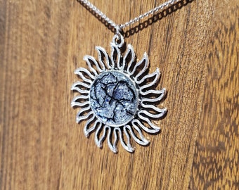 Silver and Blue Glitter Sun Necklace with Black Veins