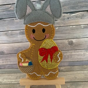 Osterhase Lebkuchenmann mit goldenem Osterei