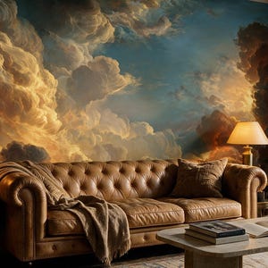 May include: A tan leather tufted sofa with a draped throw blanket, positioned against a wall mural of dramatic, golden-lit clouds. To the left stands a tall, multi-bulb brass floor lamp, and to the right, a marble coffee table with a lamp.