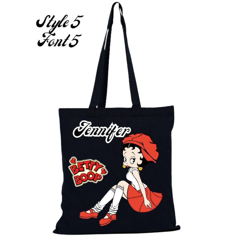 May include: Black canvas tote bag with a red and white Betty Boop graphic and the name Jennifer printed in white cursive.