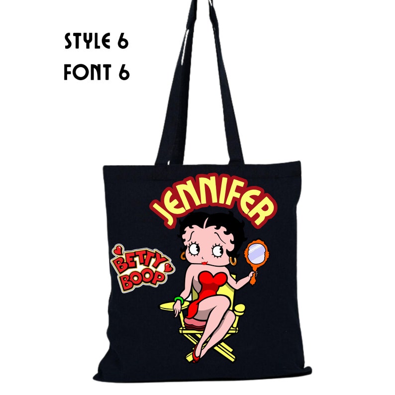 May include: Black canvas tote bag with a red and yellow Betty Boop graphic and the name "Jennifer" in yellow letters.