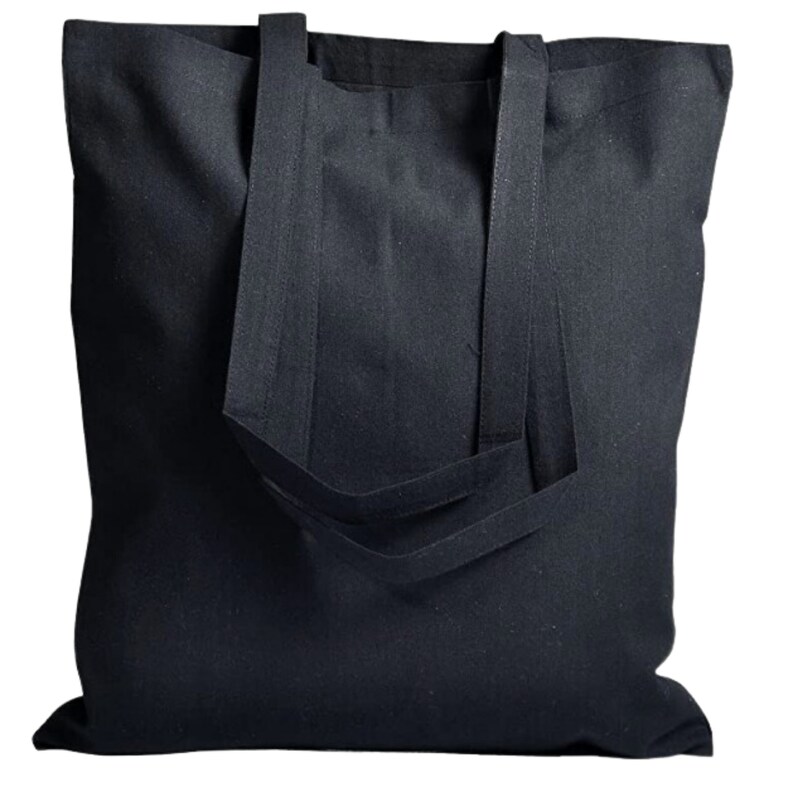 May include: A black canvas tote bag with double handles. The bag is made of a sturdy, durable material and has a spacious interior.