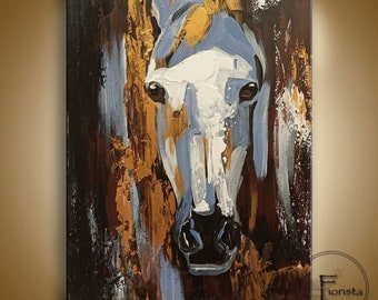 May include: Abstract painting of a white horse's head with blue, brown, and gold accents. The horse's face is the focal point of the painting, with its eyes and nose clearly visible.