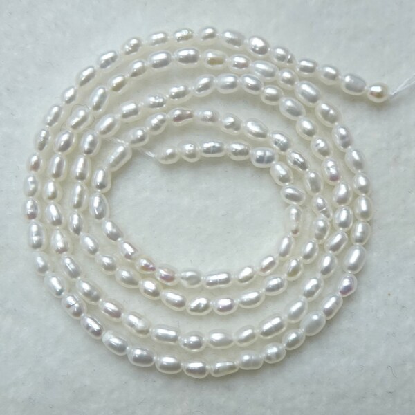 Freshwater White Rice Pearl strand 2mm-2.5mm High Quality, Genuine Pearl, Natural Bright White Color, Excellent Luster - 16" Length