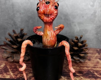 Creepy and cute macabre parasite alien