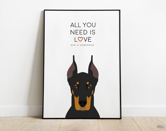 Peut inclure: Un poster blanc avec un Dobermann noir et fauve aux yeux bruns. Le texte sur le poster est "Tout ce dont vous avez besoin, c'est de l'amour et d'un Dobermann". Le cœur dans le texte est rouge.