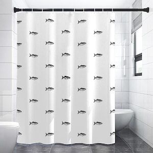 May include: White shower curtain with a repeating pattern of black fish illustrations. The curtain is hanging in a bathroom setting, with a toilet and window visible in the background. The fish are stylized and evenly spaced.