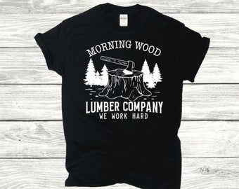May include: Black t-shirt with a white graphic of an axe stuck in a tree stump. The text "Morning Wood Lumber Company We Work Hard" is printed below the graphic.