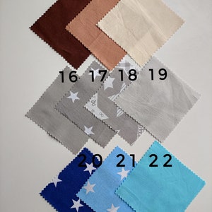 May include: A collection of 10 fabric swatches in various colors and patterns. The swatches are numbered 13 through 22. The swatches include brown, peach, beige, gray, blue, and light blue. Some swatches have a white star pattern.
