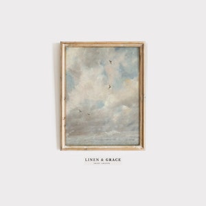 May include: A framed painting depicting a cloudy sky with birds flying in formation. The sky is a light blue with white clouds. The painting is in a simple wooden frame.