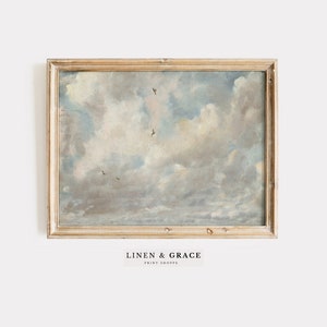 May include: A framed painting depicting a cloudy sky with birds flying in formation. The painting is in a light wood frame and has a vintage aesthetic.